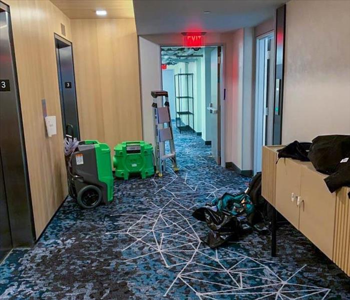 Hotel waiting area with air movers after leak
