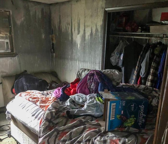 Severe fire damage in a bedroom